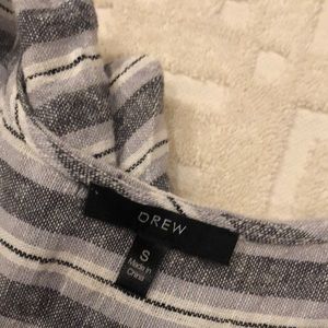 Gray and cream toned summer dress with faux wrap front.Has a slight High low hem